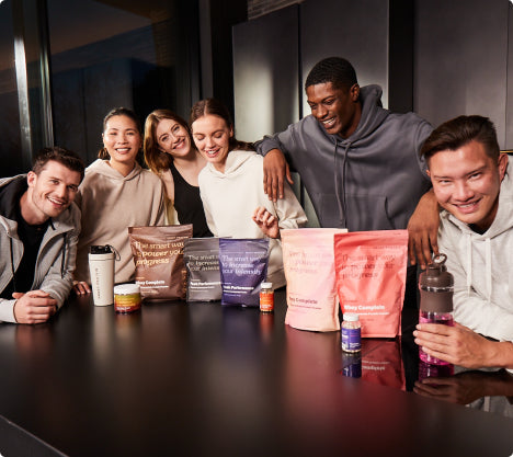 Group Of Smart Protein Customers With Supplements Around Table